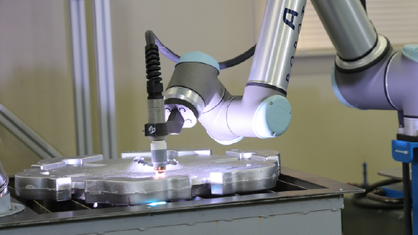 image of a cobot cutting casts