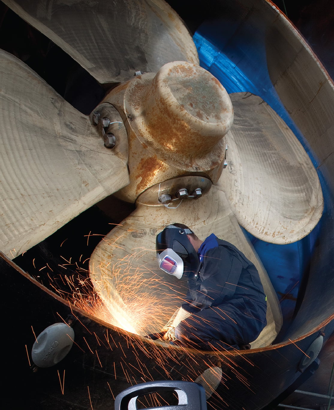 cutting metal on ship propeller